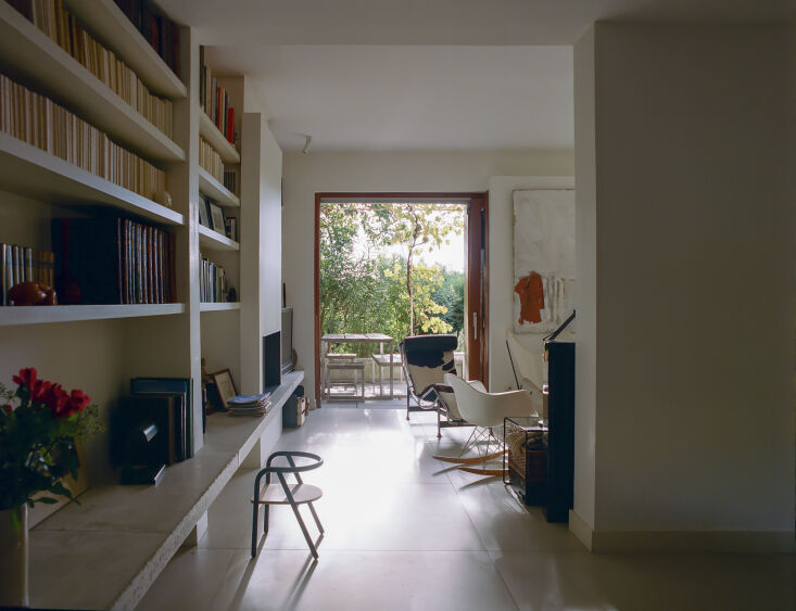 the cowhide lounge chair is by le corbusier. the living room bookshelf was part 22