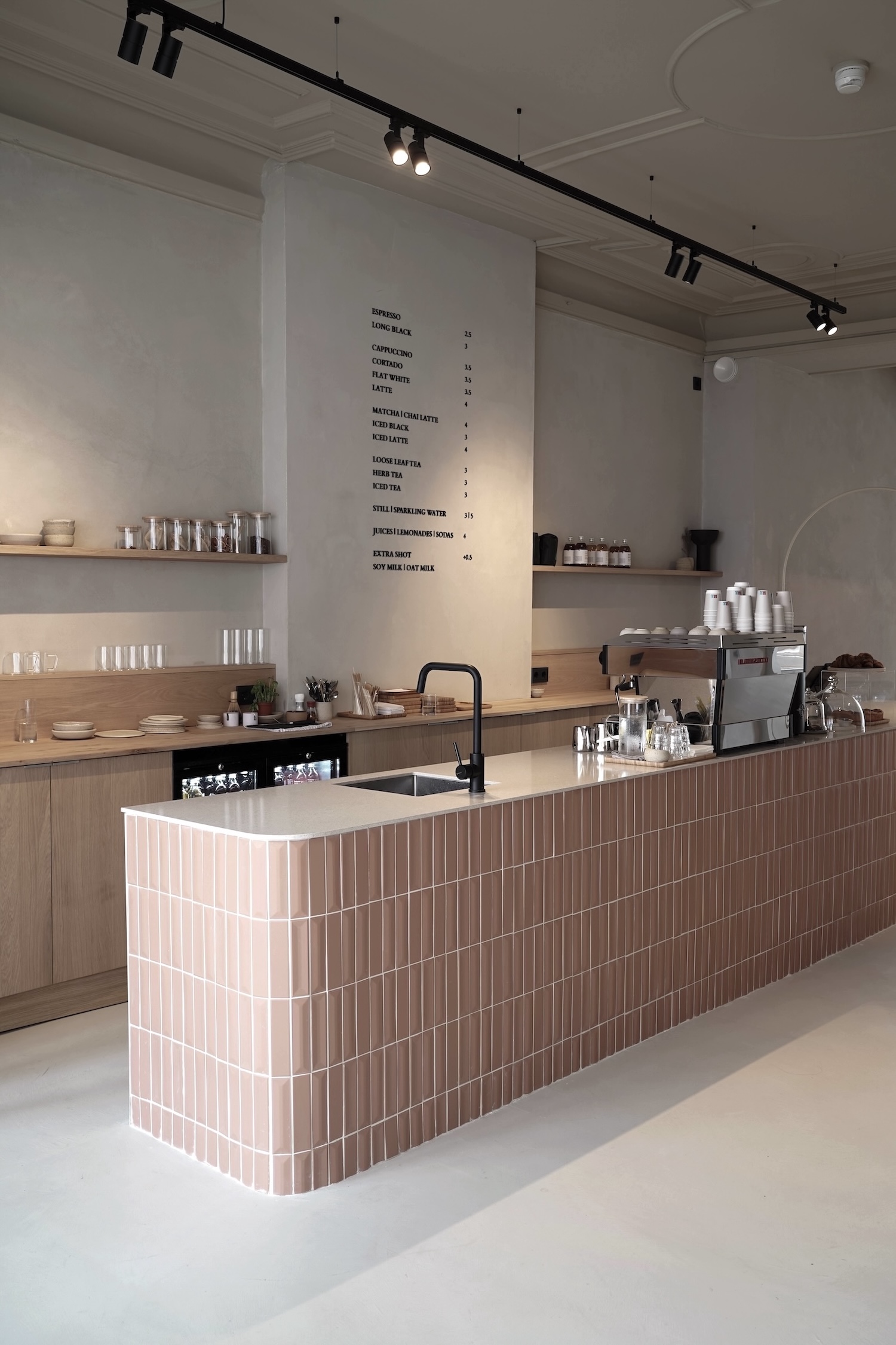 the ground floor café serves as the gathering spot for guests and locals. the 18