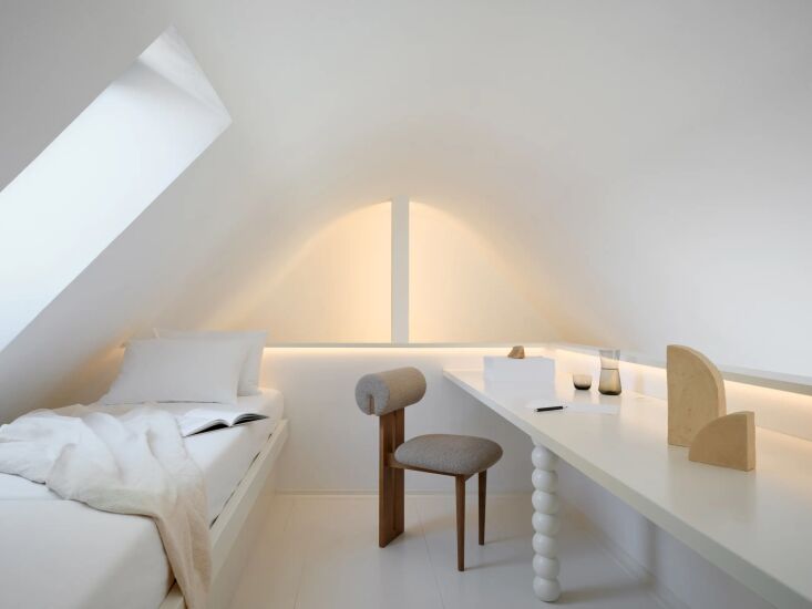 a compact guest room and work area in the top of the attic; shown here is the h 27
