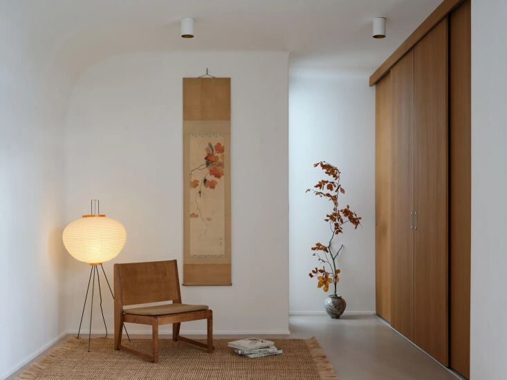 a meditation room outfitted with a ferm living athens rug, a frama easy chair 0 29