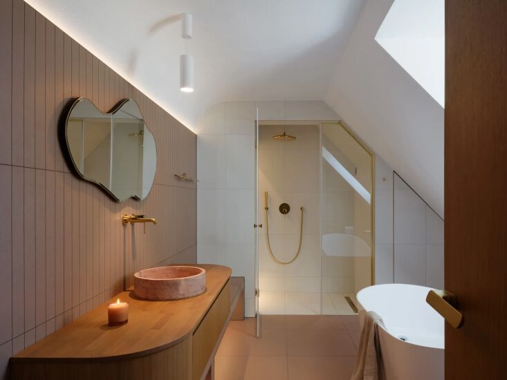 the main bathroom includes a lola red travertine washbasin from talka. 30