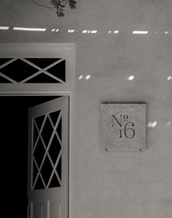 one of two engraved plaques in italian stone with the no. \16 logo is part of a 17