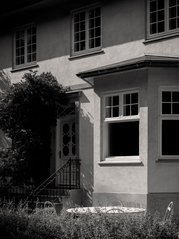 the exterior maintains original limewashed walls in red and ochre. 18