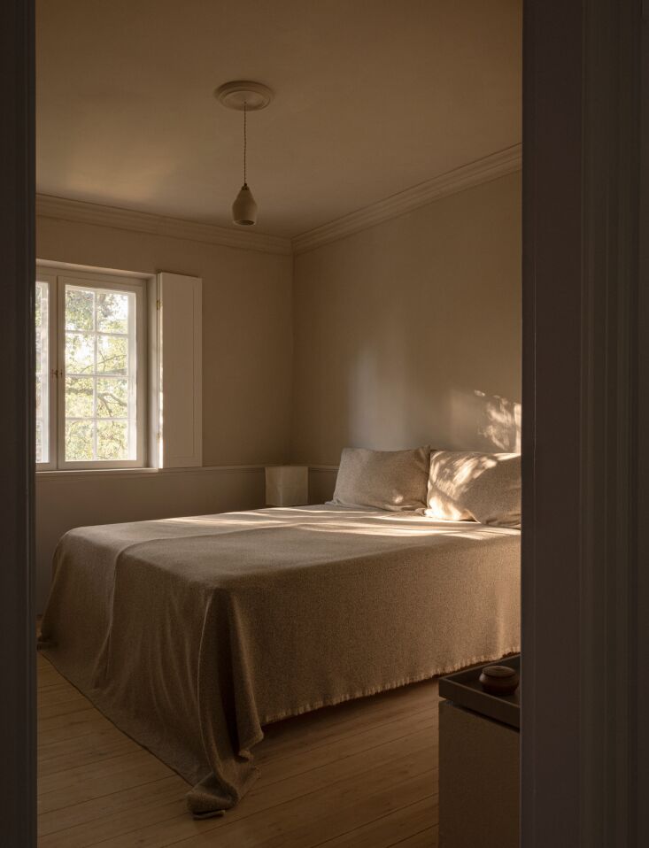 bespoke ceramic lighting and original pine floors which were coarsely sanded an 33