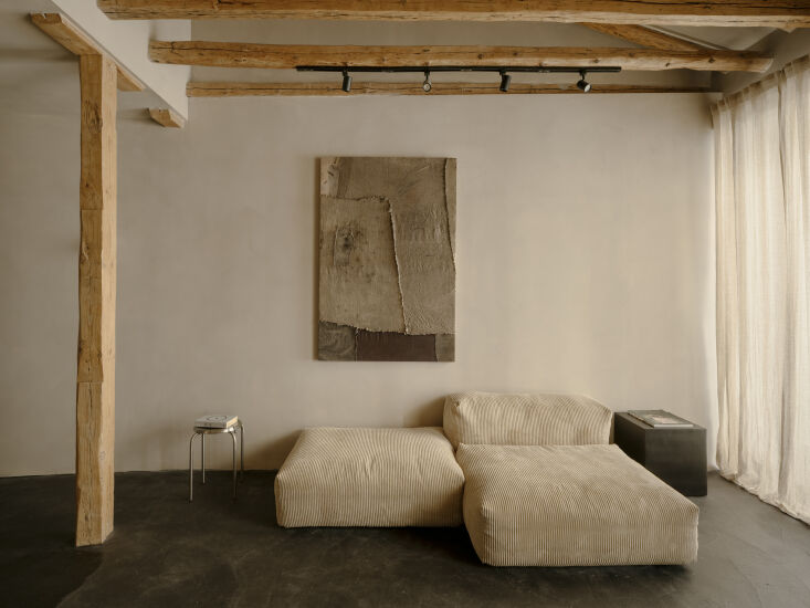 one of armando&#8\2\17;s large artworks hangs above an ivory corduroy vetsa 21