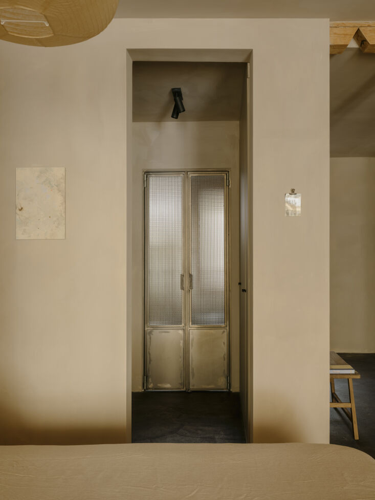 metal doors lead to the bathroom. 24