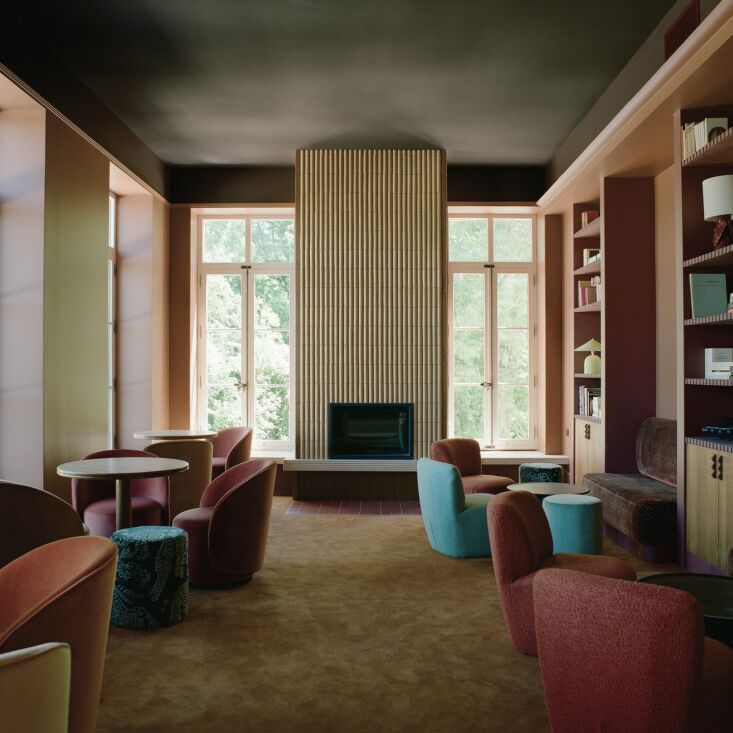 a fireplace lounge which girard outfitted with italian lounge chairs from innov 19