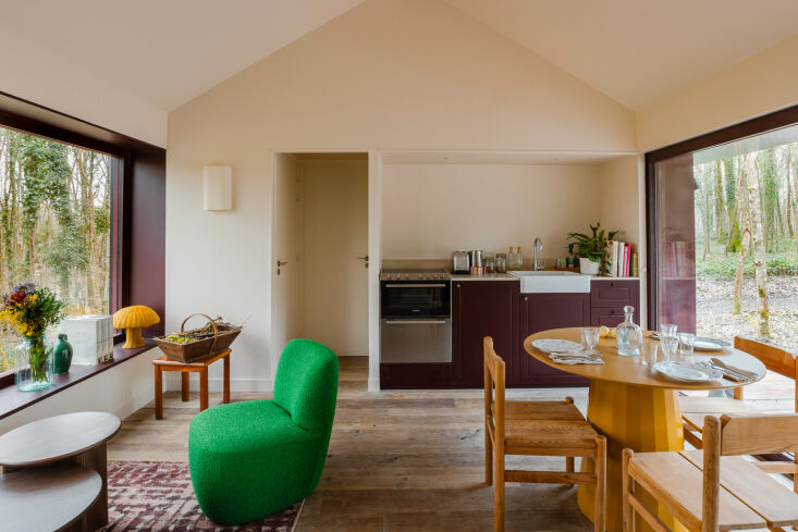 among the colorful accents in the wild houses are green bouclé upholstered cha 24