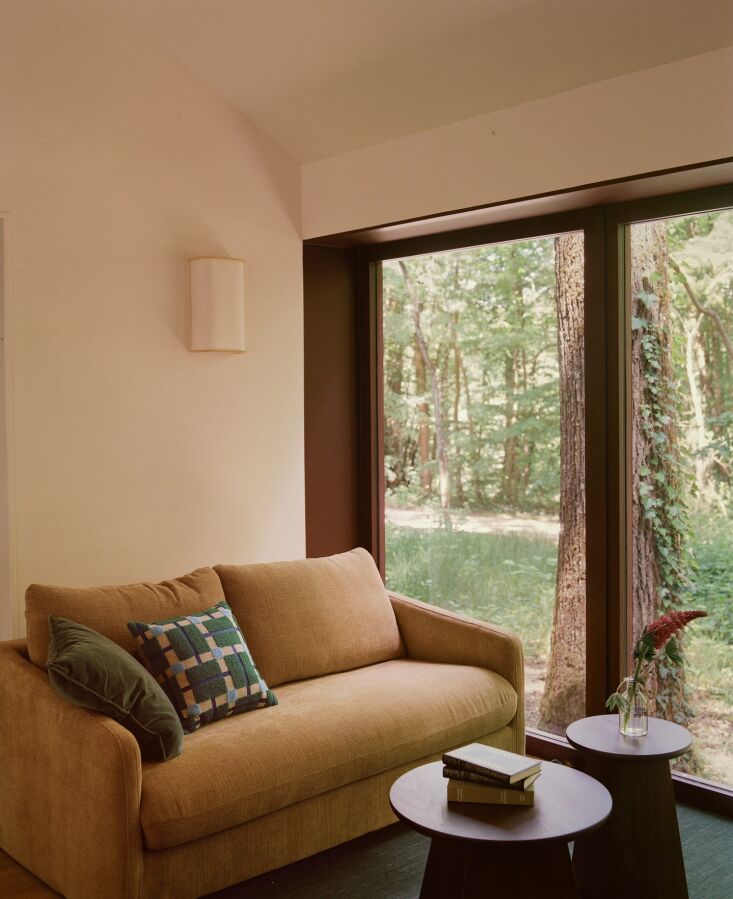 a compact seating area with a velvet upholstered loveseat. 25