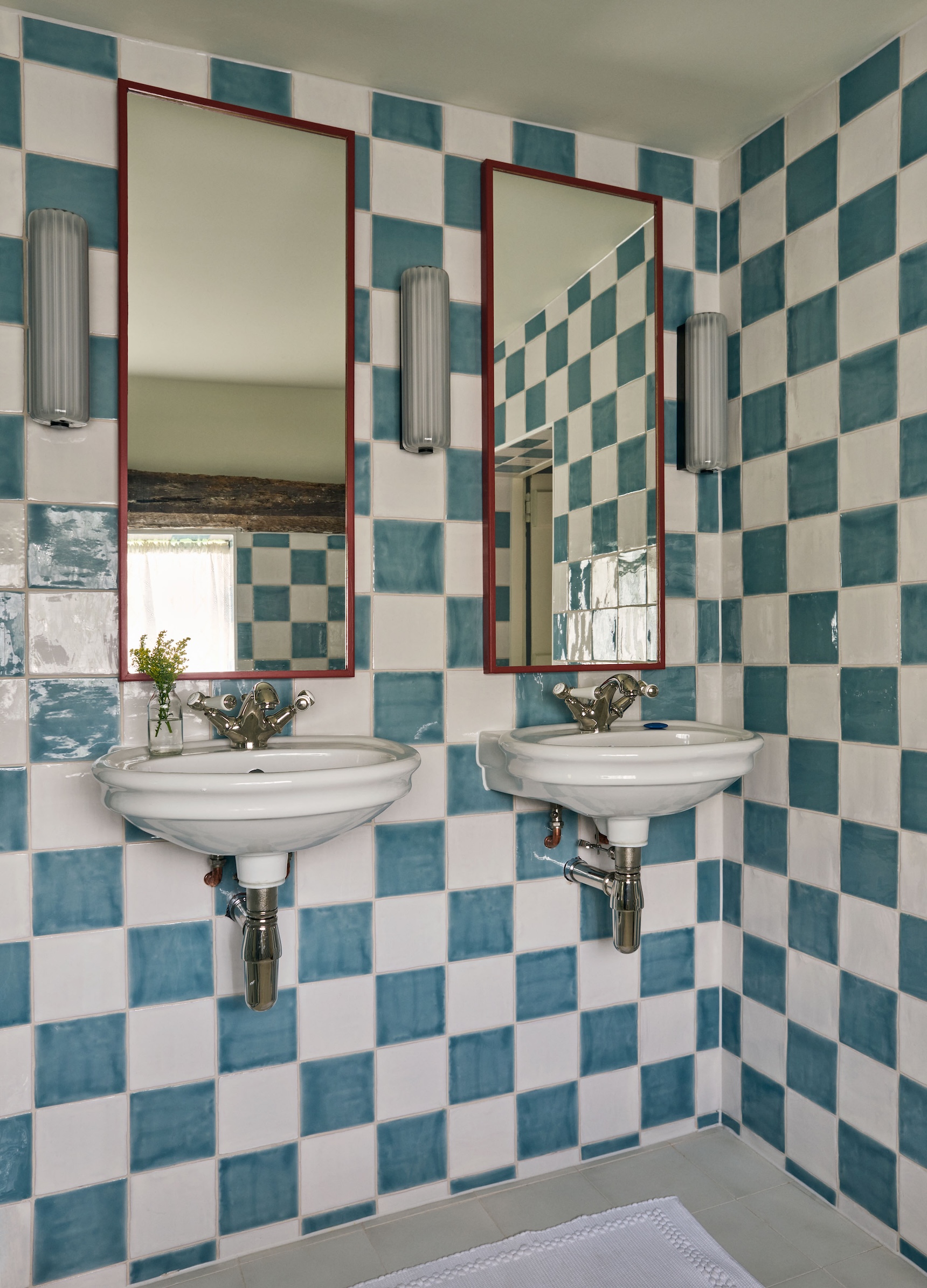 hollond used a large checkerboard of bert & may glossy tiles to transform a 22