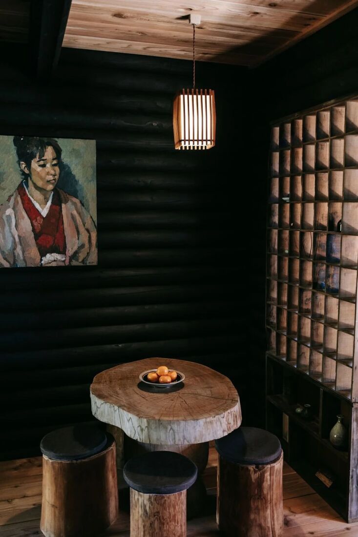 the team stained the interiors black to moody effect; note also the blocky hand 11