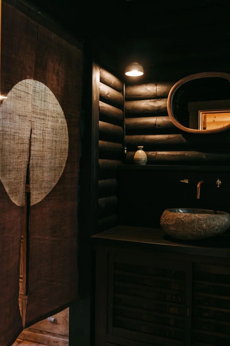 a noren hangs in the bath of a vacation rental in hokkaido, japan. for a simila 20