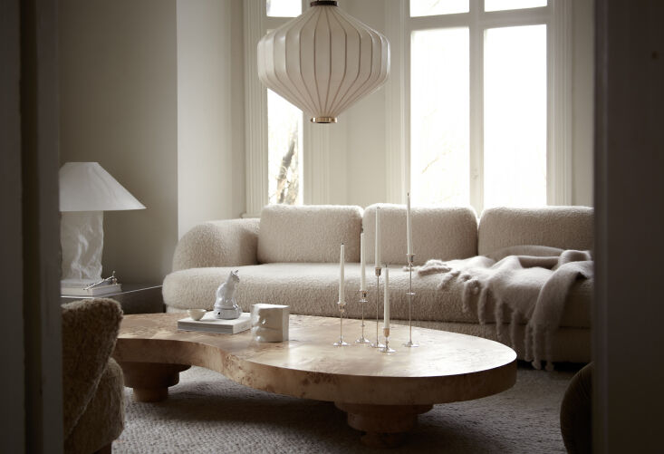 the living room is anchored with the low mung coffee table in burl wood topped 22