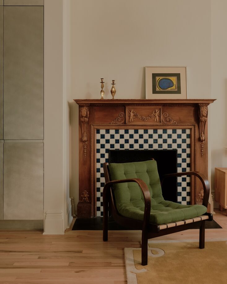 in front of the restored fireplace, a \1940s kozelka and kropácek lounge chai 19