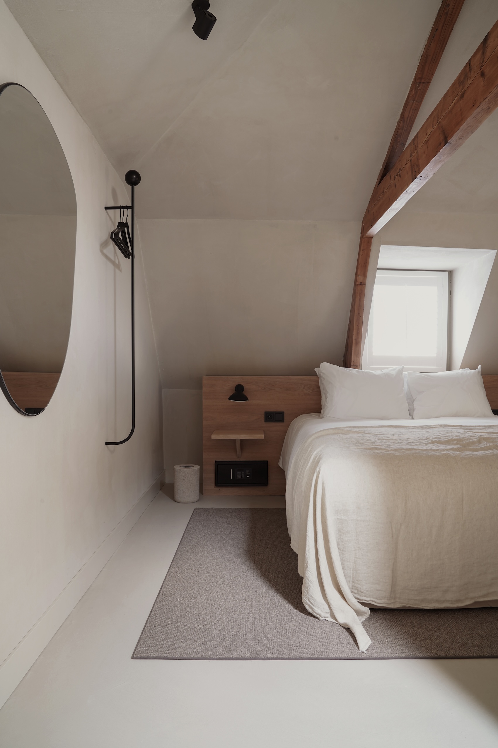 an attic room. the compact clothing rack is the discontinued pujo from ferm liv 26
