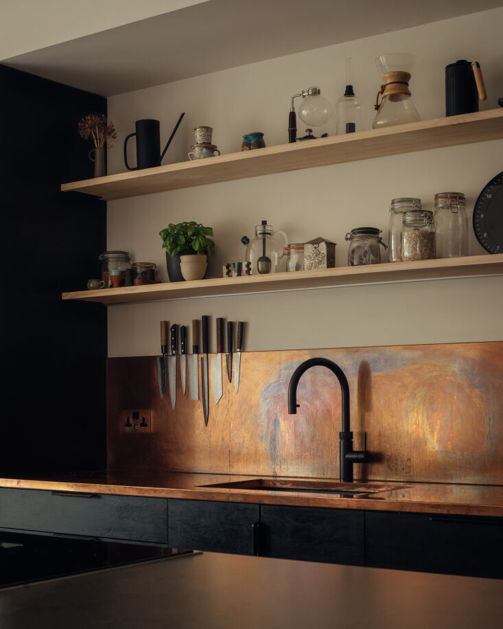 along the back wall, a copper counter and backsplash will patina over time. 22