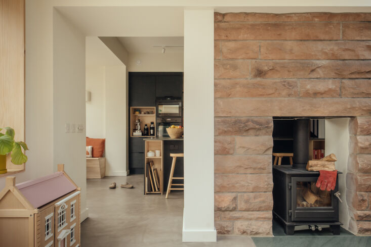 an original sandstone wall, which once belonged to the exterior, has been trans 25