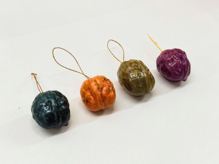 once the toothpick is removed, a single strand of thread or twine is knotted in 24