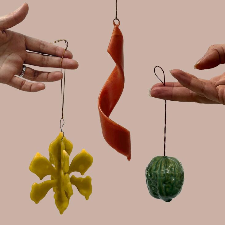 paper cuttings turned into a snowflake, a ribbon like shape formed from beeswax 25