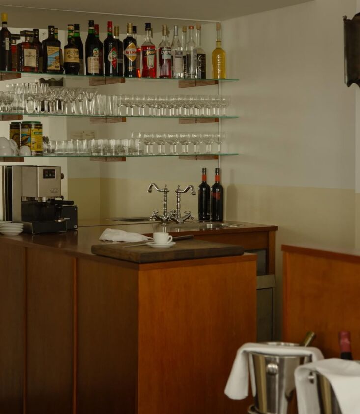 the opposite side of the bar reveals classical glass shelves mounted on a mirro 21