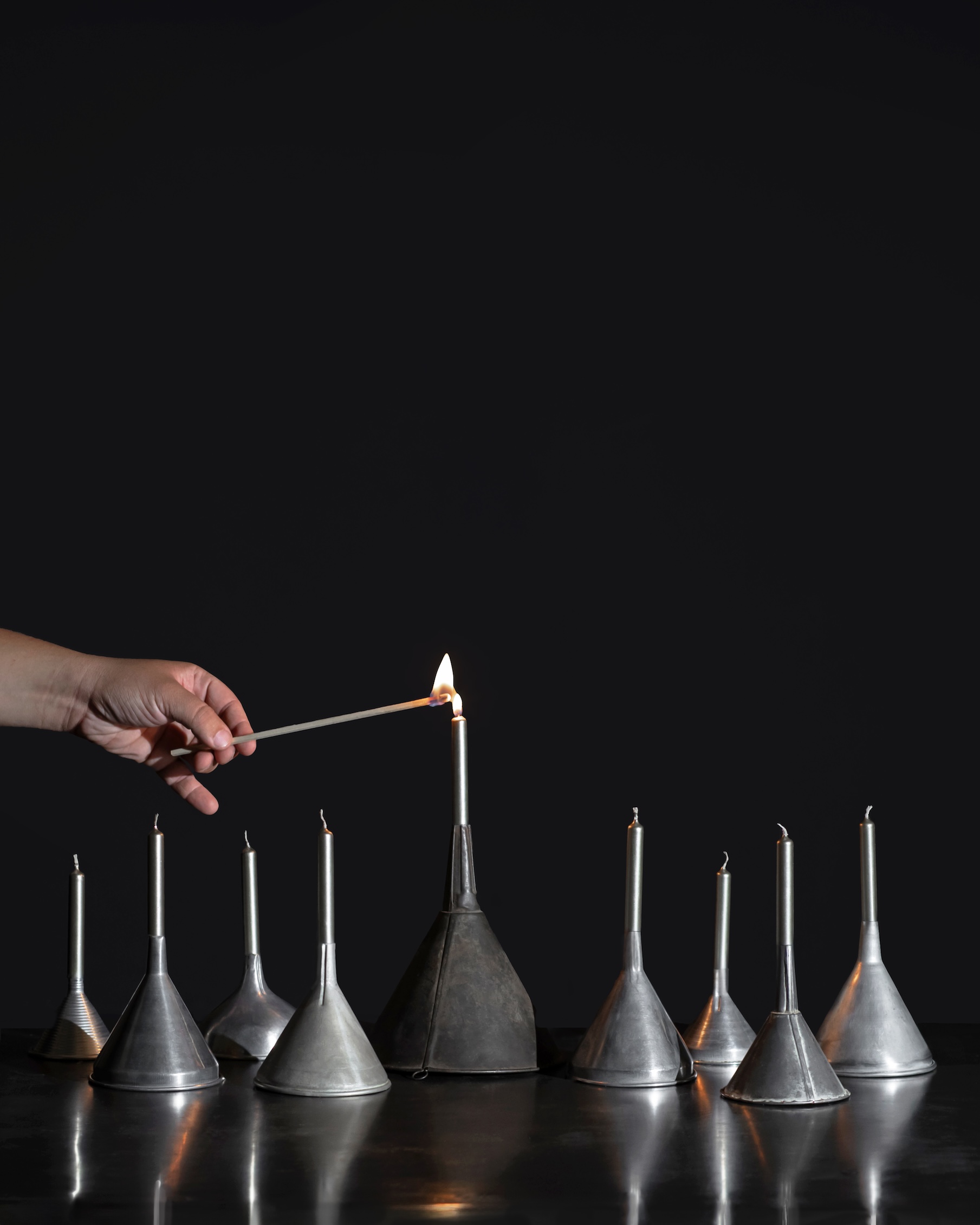 once david and susie had collected nine vintage metal funnels and companion sil 24