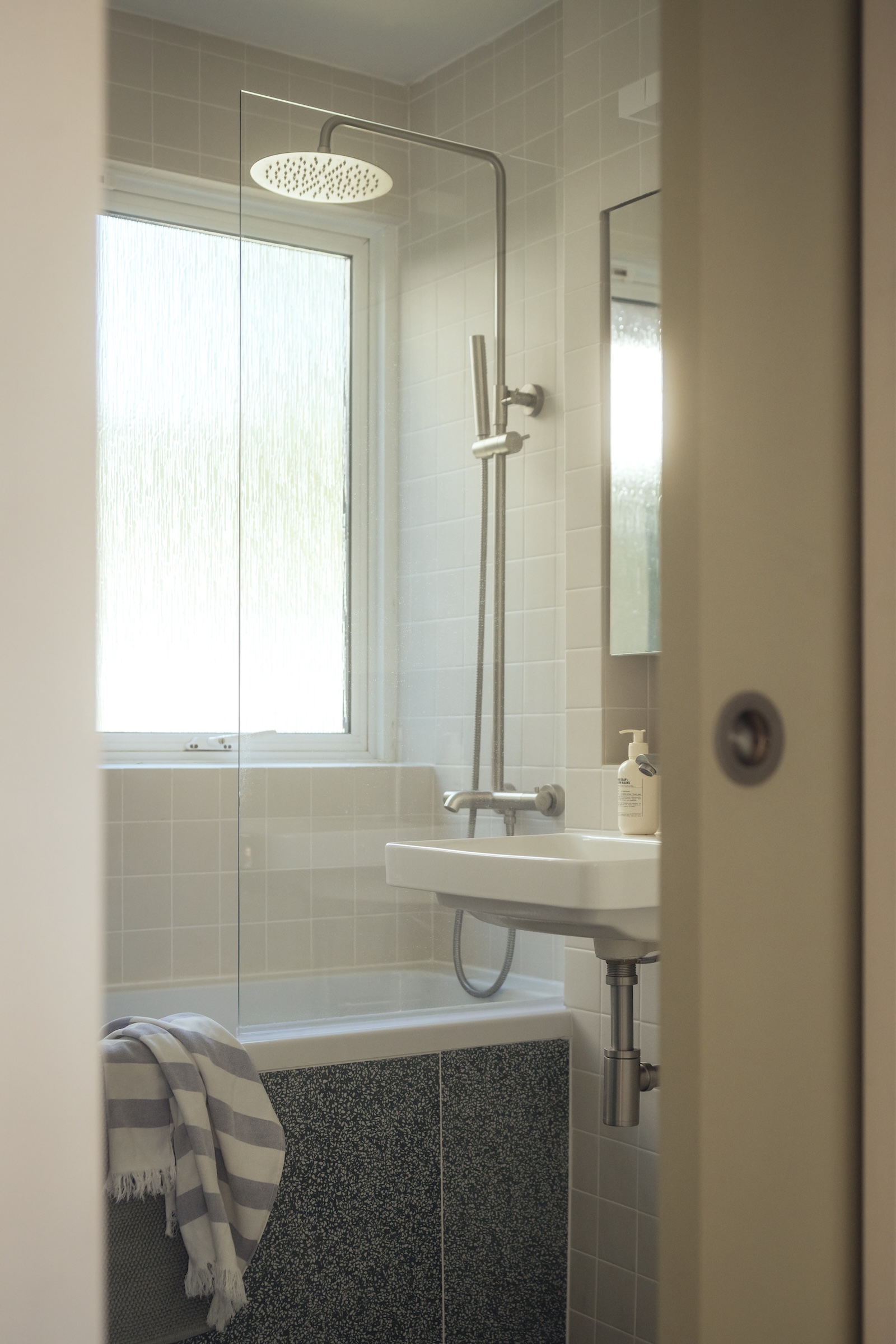 the bathroom was given all new fittings, including a pocket door, nôsa lagos s 22