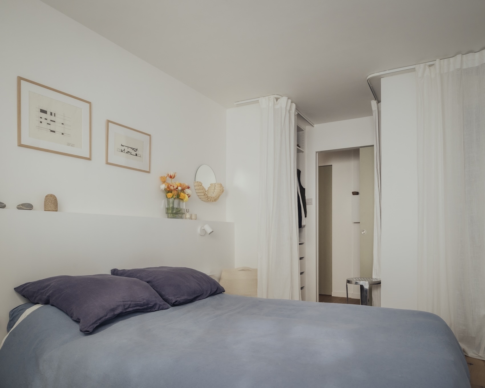 formerly swallowed up by giant mirrored cupboards, the bedroom now has a curtai 25