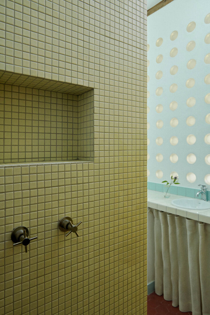 square tiles and round glass blocks in the attic bathroom. 25
