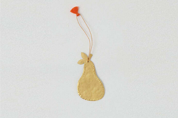 hand cut, with a hand hammered edge and colorful tassel, this pear ornament rem 19