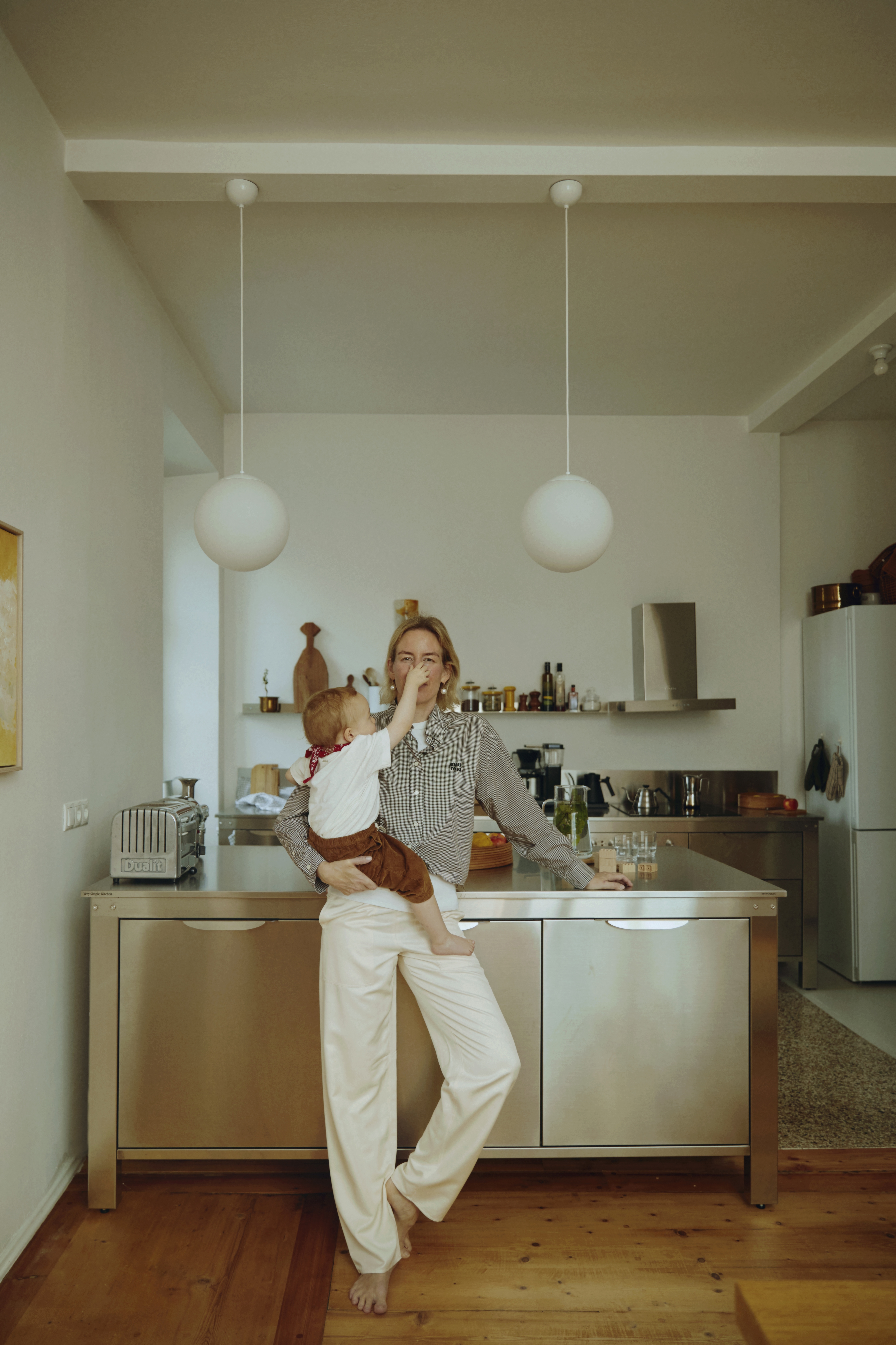 celia with son, albert, \2\20;with the open layout, the kitchen has beco 20