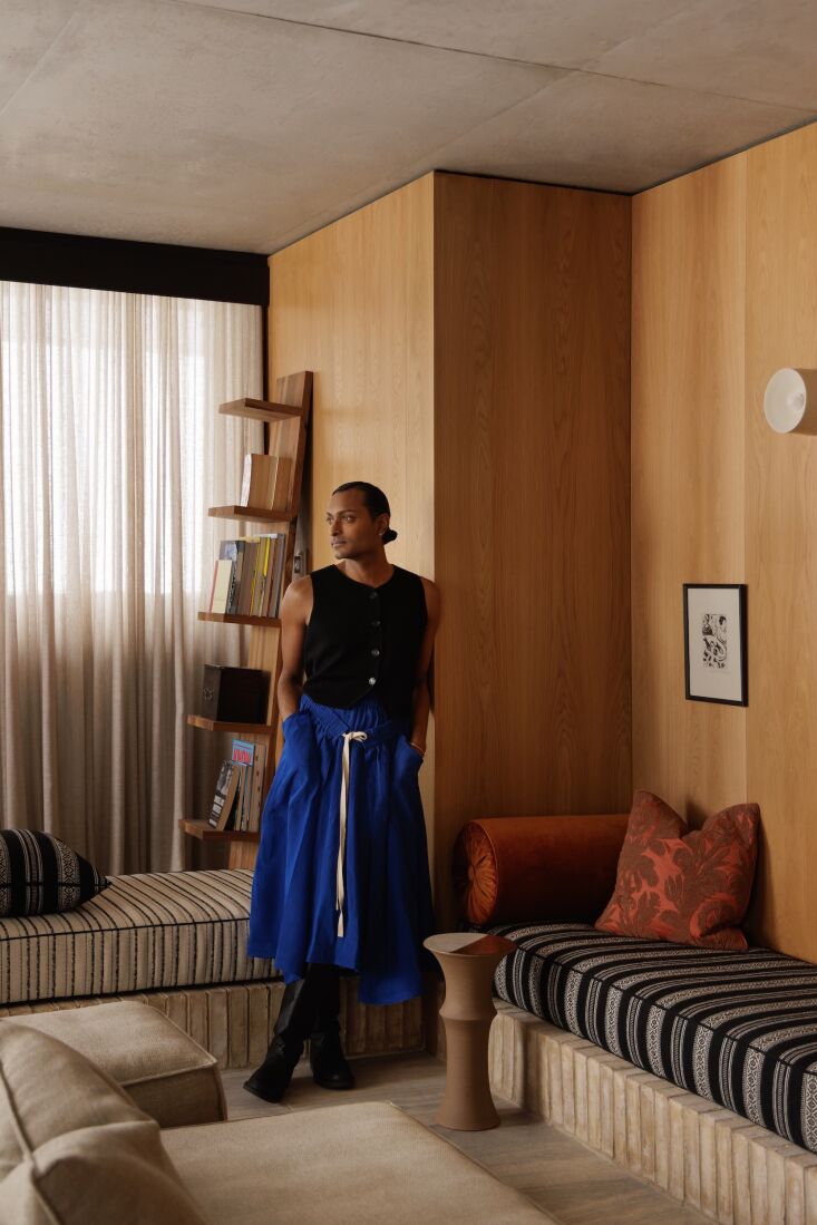 brem wears a pleated silk skirt by australian designer lee matthews and a knit 20
