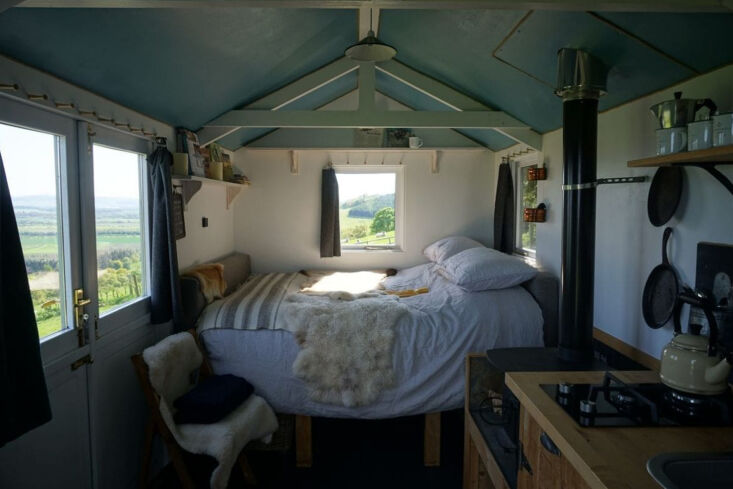 a shepherd\2\17;s hut bed nestled among a flock of hebridean sheep at gu 28