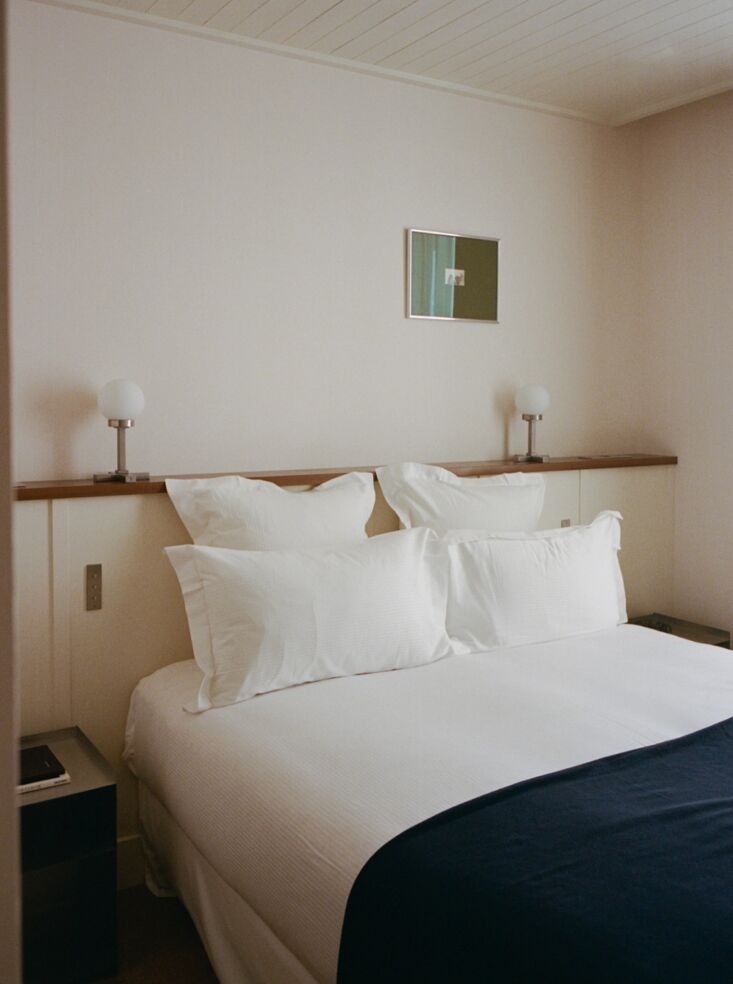a pair of vintage globe table lamps on the bed ledge. 22