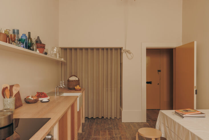 tucked into the concealed alcove, there\2\17;s another countertop, washi 23