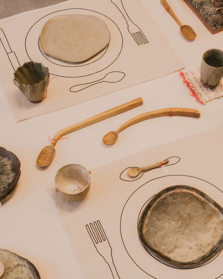 a setting of the minimaliste solo placemat in black showcases the playful way t 27