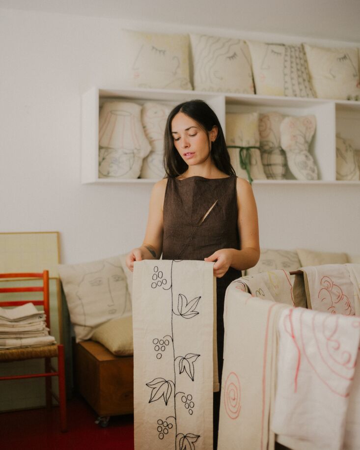 sarah showcases one of her table runners embroidered in black. 24