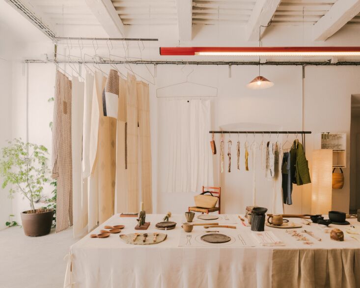 a rack of clothing curtains, a collection where large scale shirting becomes a  28