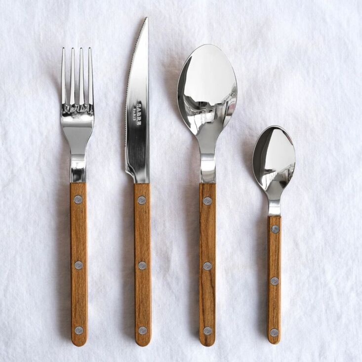 sabre also offers its bistrot flatware with teak handles, a set of four is \$84 20