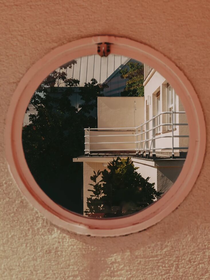 reminiscent of ship building and the sanatoriums of the era, a porthole window  28
