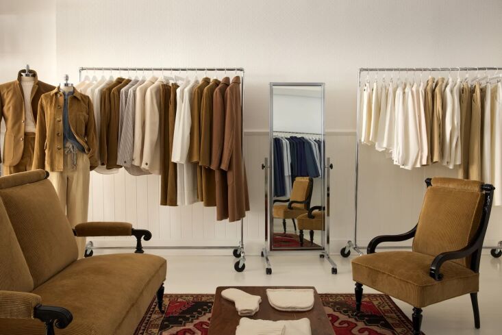 racks of alpaca and corduroy coats and hand knit cashmere accessories on the co 24