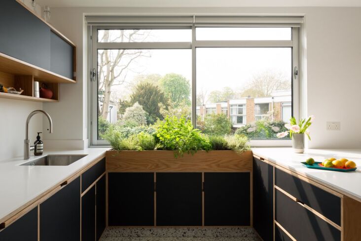 so much better than a few scraggly potted plants: an herb planter in a sunny wi 24