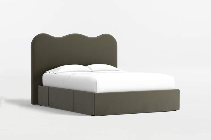 the amara curved upholstered storage bed has an undulated headboard and pull ou 22