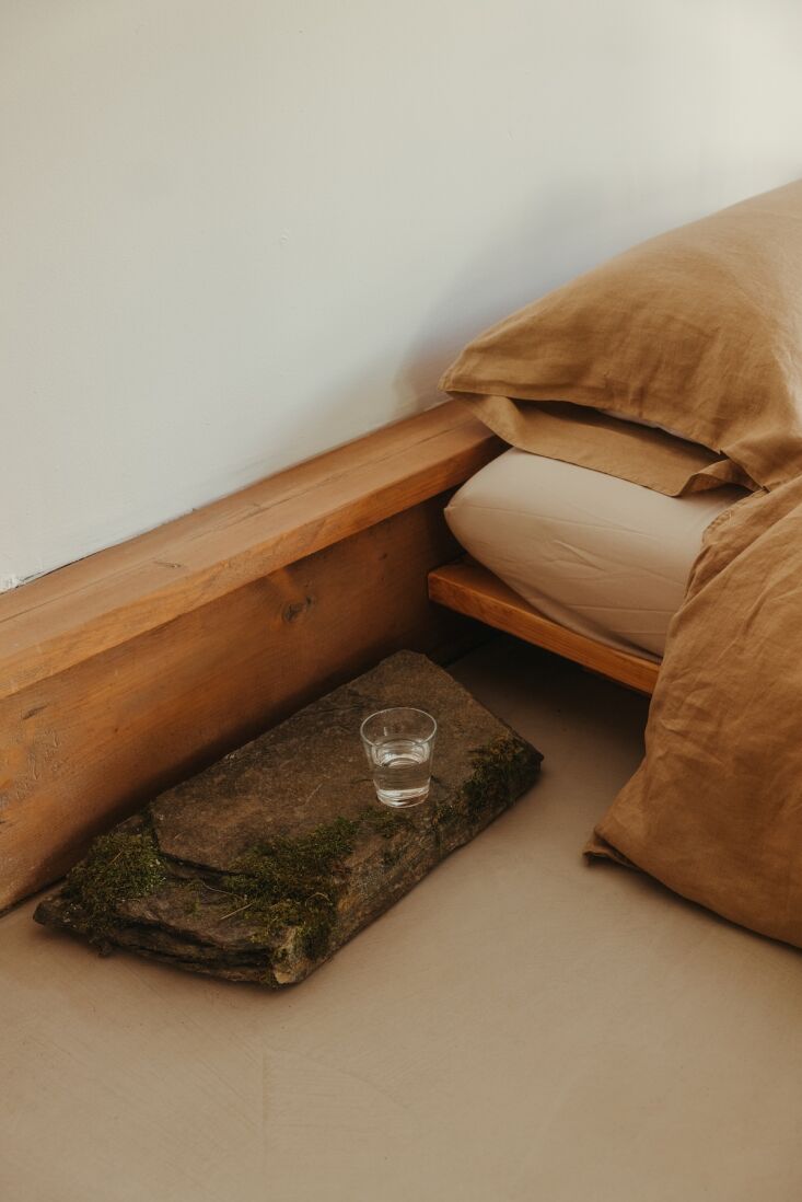 a winning detail: in lieu of a bedside table, a large slab of stone found on th 24