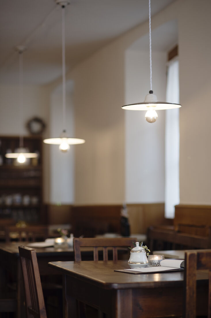 lighting is supplied by simple enamel and cut glass pendants. 26