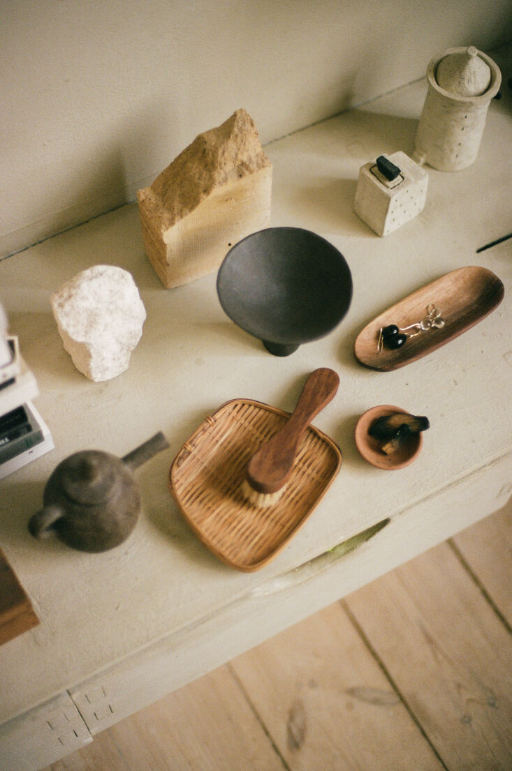 a collection of smaller pieces in stone, bamboo, ceramic, and wood. both kasia 23