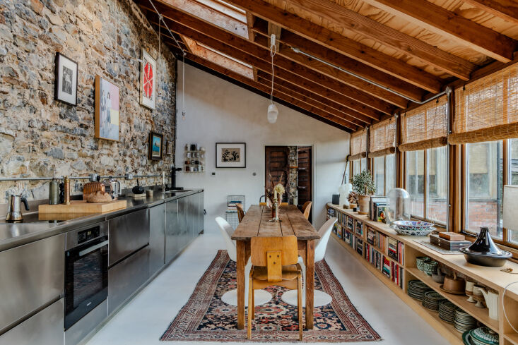 the entrance leads right into this long open kitchen and dining room. 18