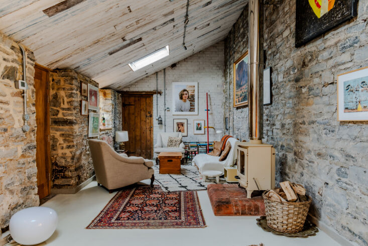 the cozy living room with a log burning stove. 23