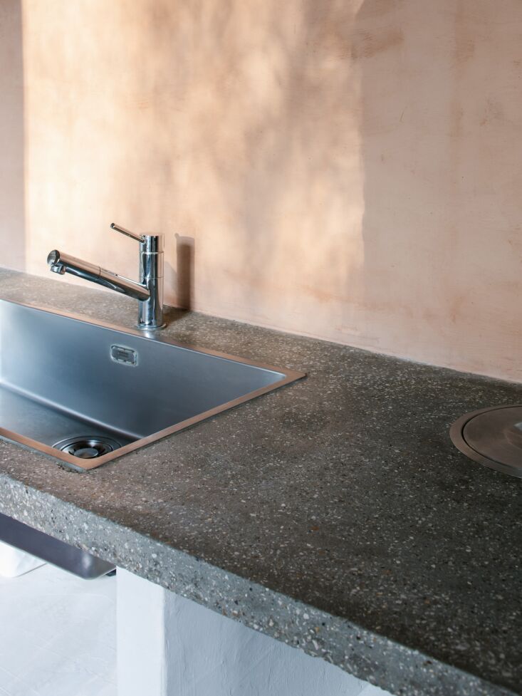 the countertop is poured concrete. 21