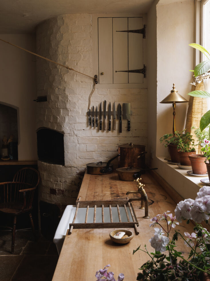 the worktop is plain english, stripped back to the raw wood and edges softened. 19