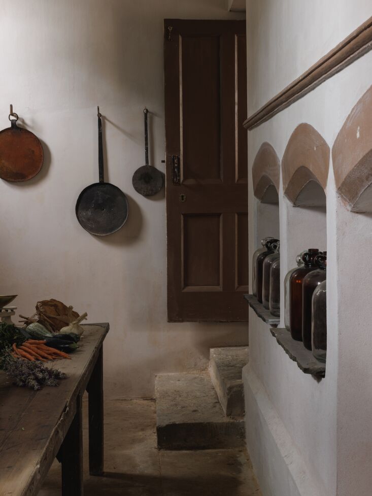 will and hayley use the space to store drinks and cold food. a long antique tab 23